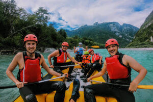 group in rafting boat on soca river